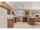 A functional kitchen with linoleum flooring and a stainless steel dishwasher at 6131 Wolff St, Arvada, CO 80003