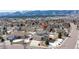 A high-angle aerial view of a home in a residential area, with mountains in the background at 15640 Agate Creek Dr, Monument, CO 80132