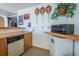 Bar area with kitchenette, sink, and mini-fridge, perfect for entertaining and easy access to refreshments at 15640 Agate Creek Dr, Monument, CO 80132