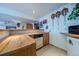 Stylish bar area featuring wooden countertops, a sink, and built-in mini-fridge for entertainment at 15640 Agate Creek Dr, Monument, CO 80132