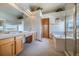 Bright bathroom with double sinks, a soaking tub, and a separate shower, offering a spa-like experience at 15640 Agate Creek Dr, Monument, CO 80132