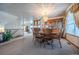 Elegant dining room featuring a chandelier, wooden table set, and classic decor at 15640 Agate Creek Dr, Monument, CO 80132