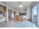 Cozy dining area with lots of light, seamless transition to the kitchen and living areas, and mountain view at 15640 Agate Creek Dr, Monument, CO 80132