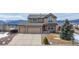Charming two-story home with a two car garage and mountain views on a sunny day at 15640 Agate Creek Dr, Monument, CO 80132