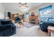 Cozy living room with a fireplace, beautiful mountain view, and a ceiling fan at 15640 Agate Creek Dr, Monument, CO 80132