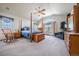 Spacious main bedroom with a vaulted ceiling, a canopy bed, and an abundance of natural light from the windows at 15640 Agate Creek Dr, Monument, CO 80132