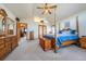 Sunlit main bedroom with vaulted ceilings and warm wood furnishings that create an inviting and comfortable retreat at 15640 Agate Creek Dr, Monument, CO 80132