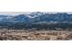 A picturesque mountain range is seen in the background of a suburban area at 15640 Agate Creek Dr, Monument, CO 80132