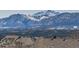 The home boasts breathtaking mountain views, with snow-capped peaks creating a scenic backdrop at 15640 Agate Creek Dr, Monument, CO 80132