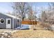 Backyard of home with grass and detached garage at 2773 S Franklin St, Denver, CO 80210