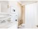Bright bathroom with a shower-tub combo, white tiling, and modern vanity at 2773 S Franklin St, Denver, CO 80210