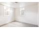 Neutral bedroom features carpeted floors and two well-lit windows at 2773 S Franklin St, Denver, CO 80210