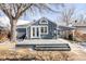 Gray home exterior with covered car port and large back deck at 2773 S Franklin St, Denver, CO 80210