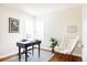 Bright home office features a modern desk, area rug, and comfortable butterfly chair at 2773 S Franklin St, Denver, CO 80210