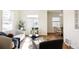 Inviting living area featuring stylish decor, hardwood floors, and abundant natural light at 2773 S Franklin St, Denver, CO 80210