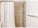 Shower with tile surround and rainfall shower head at 2773 S Franklin St, Denver, CO 80210