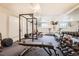 Well-equipped home gym featuring weights, benches, and cardio machines at 1045 N Clarkson St # 105, Denver, CO 80218