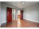 Bedroom featuring hardwood floors, neutral walls and wood closet doors at 7883 S Espana Way, Centennial, CO 80016