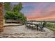 Wooden deck features an outdoor dining set, bench, and views of the surrounding landscape at 7883 S Espana Way, Centennial, CO 80016
