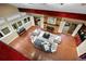 High angle of a stylish living room showcasing a brick fireplace, high ceilings, and expansive windows at 7883 S Espana Way, Centennial, CO 80016