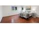 Bright bedroom features hardwood floors and a comfortable, inviting aesthetic at 7883 S Espana Way, Centennial, CO 80016