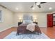 Bright main bedroom with hardwood floors, neutral walls, and plush bedding for a relaxing space at 7883 S Espana Way, Centennial, CO 80016