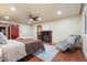 Spacious main bedroom featuring a fireplace and hardwood floors, creating a cozy retreat at 7883 S Espana Way, Centennial, CO 80016