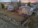Aerial view showcasing the spacious backyard, patio, and well-maintained lawn at 9144 Roadrunner St, Highlands Ranch, CO 80129