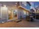 Inviting outdoor patio with a dining set, string lights, and sliding glass doors to the kitchen at 9144 Roadrunner St, Highlands Ranch, CO 80129