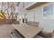 Back patio includes a outdoor dining table and chairs at 9144 Roadrunner St, Highlands Ranch, CO 80129