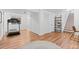 Spacious basement area features wood floors, built-in shelves, and plenty of room for activities at 9144 Roadrunner St, Highlands Ranch, CO 80129