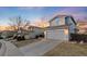 Well-maintained two-story home with a spacious driveway and two-car garage in a friendly neighborhood at 9144 Roadrunner St, Highlands Ranch, CO 80129