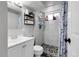 Updated bathroom with modern tile shower, stylish fixtures, and ample storage, offering a clean and functional space at 8660 De Soto St, Denver, CO 80229