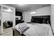 Cozy bedroom featuring a comfortable bed, mirrored closet, and a serene ambiance, creating a perfect space for rest at 8660 De Soto St, Denver, CO 80229
