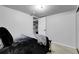 Bright bedroom featuring neutral walls, plush carpeting, and a convenient closet with an open door at 8660 De Soto St, Denver, CO 80229