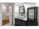 Stylish bathroom with vanity, modern fixtures, and decorative storage at 1350 Josephine St # 208, Denver, CO 80206