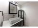 Bathroom featuring a vanity sink with modern fixtures and a decorative tile backsplash at 1350 Josephine St # 208, Denver, CO 80206