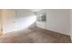 Bright bedroom with a window, neutral carpet and paint, and a double closet at 1350 Josephine St # 208, Denver, CO 80206
