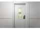 Condo unit door with decorative stained glass window and updated hardware, adding character and security at 1350 Josephine St # 208, Denver, CO 80206
