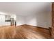 Open floor plan with hardwood floors connecting the living area to the updated kitchen at 1350 Josephine St # 208, Denver, CO 80206