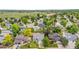 An aerial view of a residential neighborhood with mature trees and well-maintained lawns on a sunny day at 381 Mountain Cloud Cir, Highlands Ranch, CO 80126