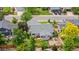 An aerial view of a residential property with a well-maintained backyard and mature trees in the yard at 381 Mountain Cloud Cir, Highlands Ranch, CO 80126