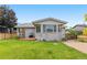 Landscaped backyard featuring a deck, well-maintained lawn, and privacy fence, ideal for outdoor living at 381 Mountain Cloud Cir, Highlands Ranch, CO 80126