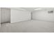 Large basement with neutral carpet, white walls, and a small window at 381 Mountain Cloud Cir, Highlands Ranch, CO 80126
