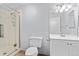 Clean bathroom featuring a glass-enclosed shower, modern toilet, and a vanity with ample storage at 381 Mountain Cloud Cir, Highlands Ranch, CO 80126