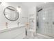 Contemporary bathroom with double vanity, modern fixtures, and glass-enclosed shower at 381 Mountain Cloud Cir, Highlands Ranch, CO 80126