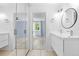 Bright bathroom with double vanity and view into the bedroom at 381 Mountain Cloud Cir, Highlands Ranch, CO 80126