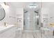 Modern bathroom features a walk-in shower, double vanity, and tiled floors at 381 Mountain Cloud Cir, Highlands Ranch, CO 80126