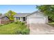 Charming home featuring a well-maintained lawn, attached two-car garage and inviting curb appeal at 381 Mountain Cloud Cir, Highlands Ranch, CO 80126