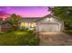 Charming home featuring a well-manicured lawn and a two-car garage with a concrete driveway at 381 Mountain Cloud Cir, Highlands Ranch, CO 80126